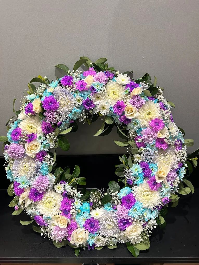 Wreath of purple, blue and white flowers